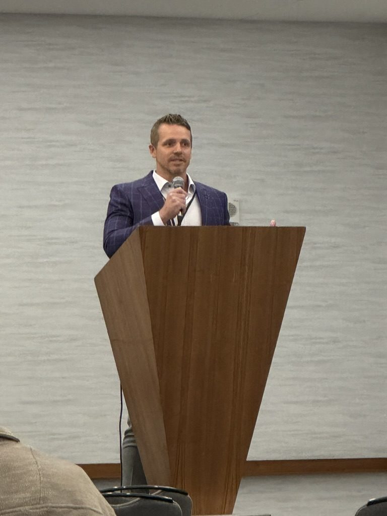 At the podium