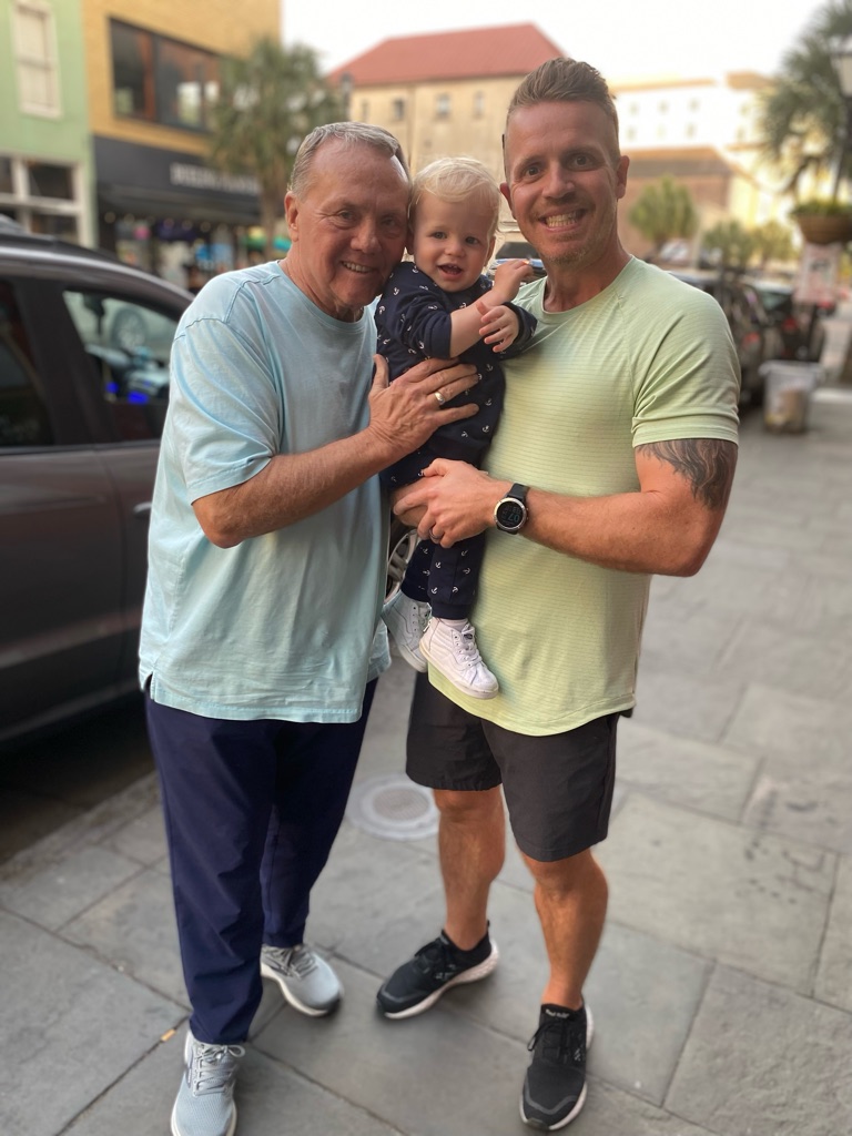 Dr. Kyle Stephenson with three generations of his family on a downtown street
